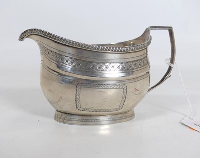 Lot 199 - A George III silver milk jug, of oval bombe...