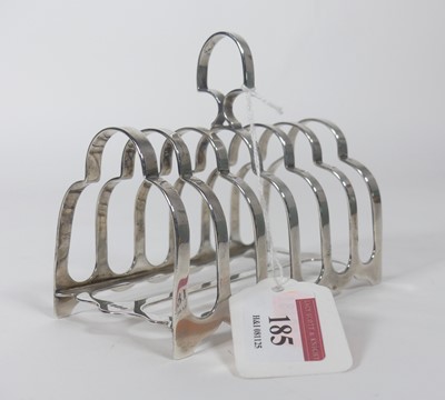 Lot 185 - A George V silver toast rack having six arched...