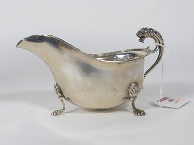 Lot 188 - A George V silver sauce boat having a beaded...