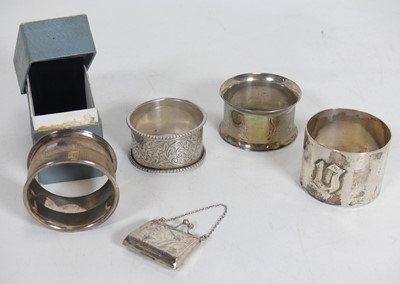 Lot 212 - A 1970s silver napkin ring, having engine...