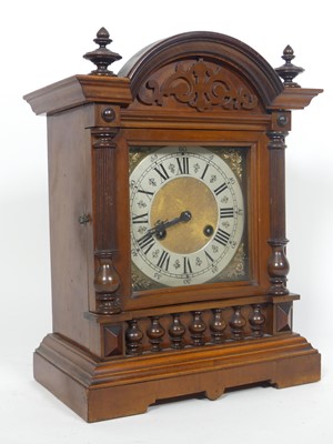 Lot 107 - A late 19th century walnut cased mantel clock,...