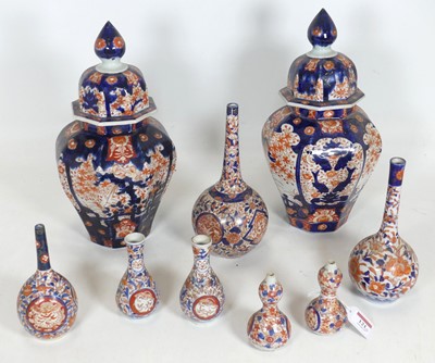 Lot 121 - A collection of Japanese Imari porcelain vases,...