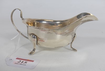 Lot 215 - A mid-20th century silver sauceboat, of plain...