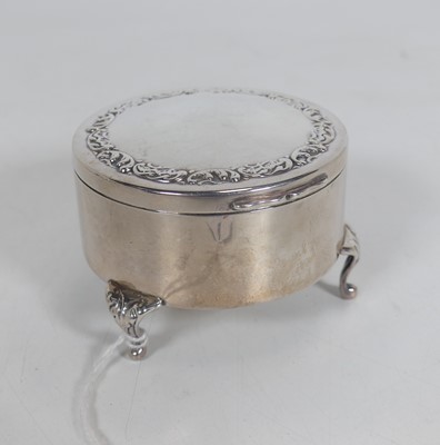 Lot 224 - An Edwardian silver trinket box, of circular...