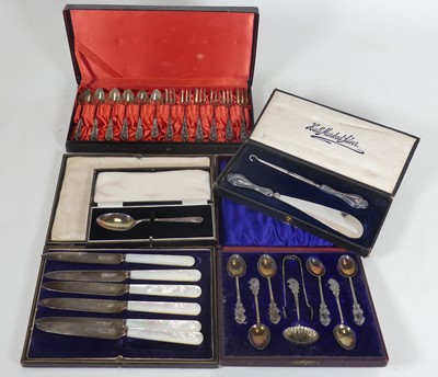 Lot 319 - A set of six Eastern white metal spoons and...