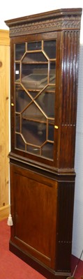 Lot 1142 - A 19th century mahogany freestanding corner...