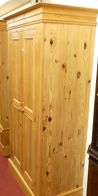 Lot 1143 - A contemporary pine double door wardrobe, w.100cm