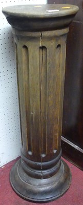 Lot 1148 - A hardwood circular fluted plant stand, h.77cm