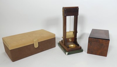 Lot 125 - A hardwood and brass novelty cigar cutter in...