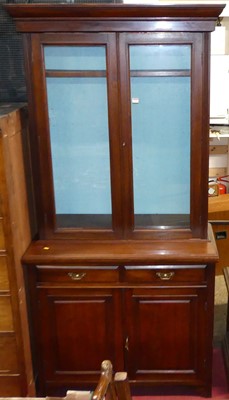 Lot 1162 - An Edwardian walnut bookcase cupboard, having...