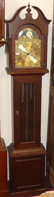 Lot 1166 - A reproduction mahogany grandmother clock,...