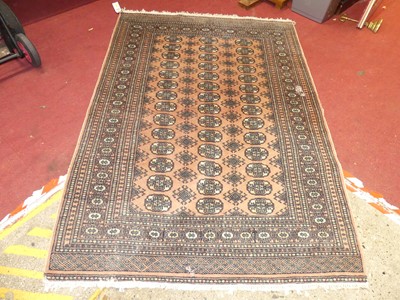 Lot 1172 - A Persian pale peach ground woollen Bokhara...
