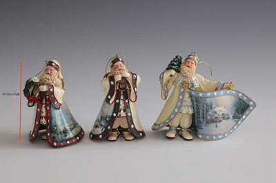 Lot 407 - A group of nine Thomas Kinkade Old World Santa...