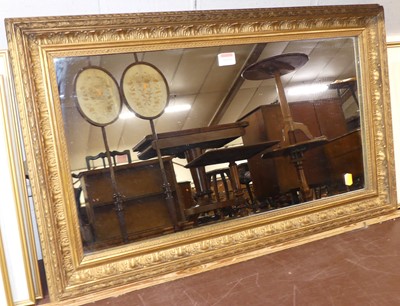 Lot 1039 - A gilt composition framed wall mirror, early...
