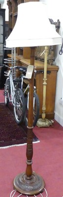 Lot 1181 - A floral relief carved and fluted standard...