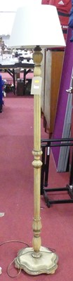 Lot 1185 - A cream painted fluted standard lamp, with shade