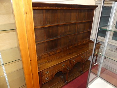 Lot 1194 - A joined oak dresser, having three-tier open...