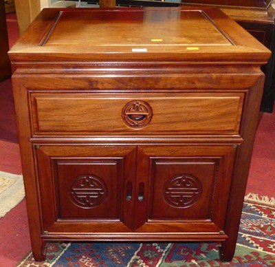 Lot 1200 - A contemporary Eastern hardwood low cube chest,...