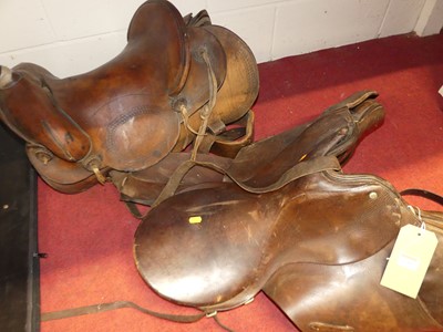 Lot 1085 - A leather riding sadldle; together with one...