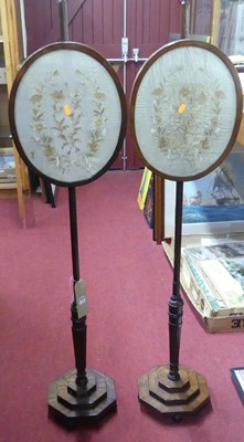 Lot 1220 - A pair of Regency mahogany pole screens,...