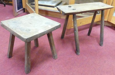 Lot 1236 - Two rustic elm milking stools, the larger...