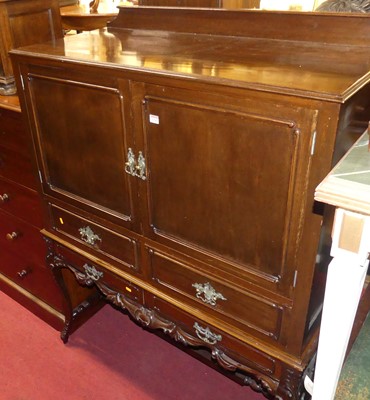 Lot 1241 - A walnut double door side cabinet on stand,...