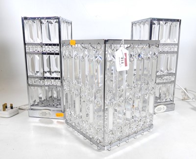 Lot 414 - A pair of Laura Ashley chrome and glass table...