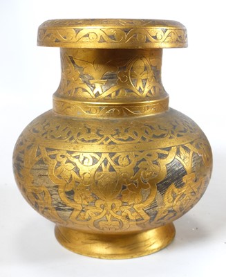 Lot 437 - An Islamic gilt metal vase, of bulbous form,...