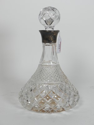 Lot 444 - A cut glass ship's decanter, having a silver...