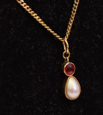 Lot 272 - A yellow metal split pearl and garnet set...
