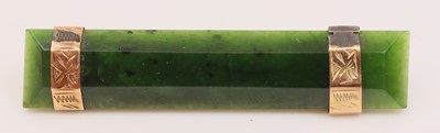 Lot 276 - An Art Deco faceted nephrite and yellow metal...