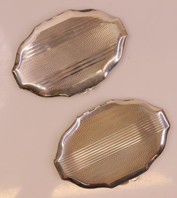 Lot 288 - A pair of Art Deco engine turned silver powder...
