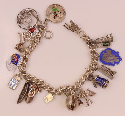 Lot 299 - A silver curblink bracelet, containing a...