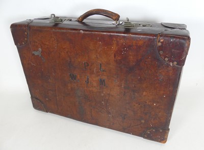 Lot 537 - An early 20th century tan leather suitcase,...