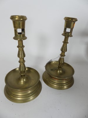 Lot 475 - A pair of 19th century brass candlesticks,...