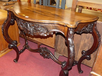 Lot 1257 - A contemporary hardwood serpentine console...