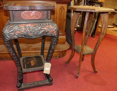 Lot 1262 - A Chinese black and red lacquered two-tier urn...