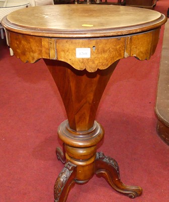 Lot 1268 - A mid-Victorian figured walnut circular hinge...