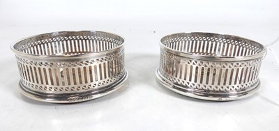 Lot 425 - A pair of Elizabeth II silver bottle coasters,...