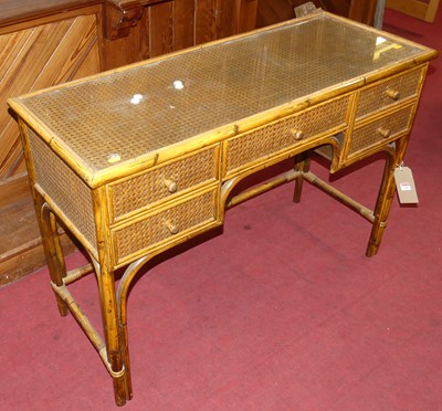 Lot 1281 - A stained bamboo and cane inset kneehole...