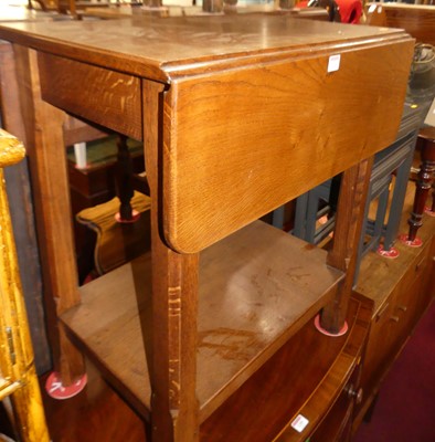 Lot 1284 - A joined oak dropflap two-tier occasional...