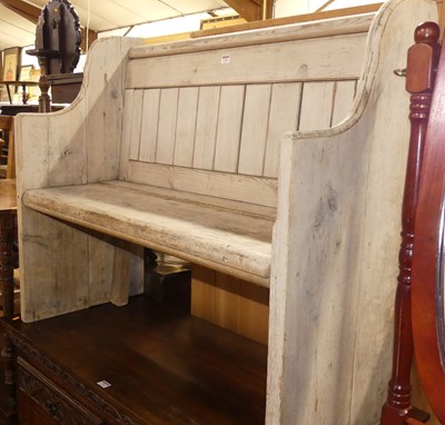 Lot 1292 - A rustic faded pine two-seater pew, w.107cm