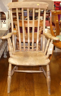 Lot 1301 - An early 20th century elm and beech slat back...