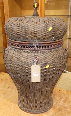 Lot 1306 - A wicker and wired metal snake charmer's...