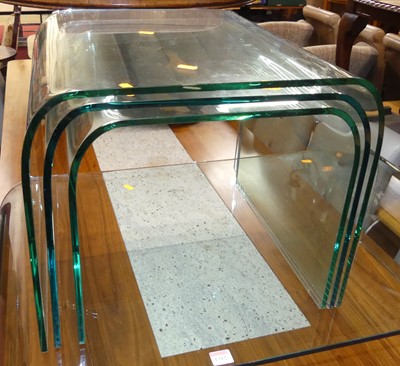 Lot 1312 - A contemporary heavy curved plate glass low...