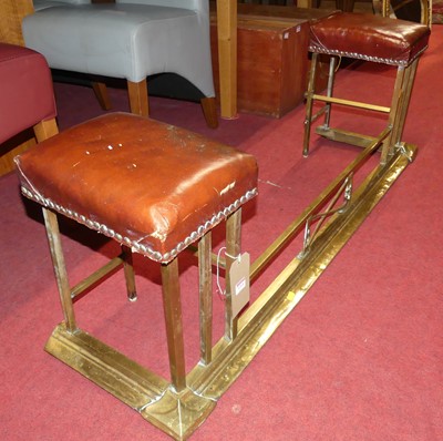 Lot 1314 - An Edwardian brass club fender, having raised...