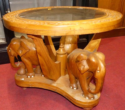 Lot 1317 - An Indian relief carved teak and glass inset...