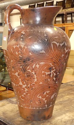 Lot 1318 - A floral painted terracotta floor jug of...