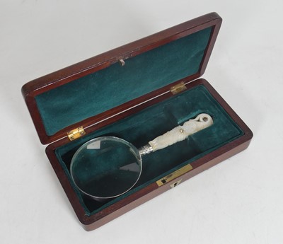 Lot 355 - A magnifying glass having a silver collar and...