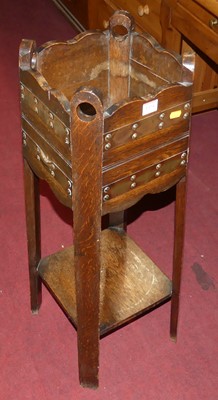 Lot 1374 - An Arts & Crafts oak, copper mounted and brass...